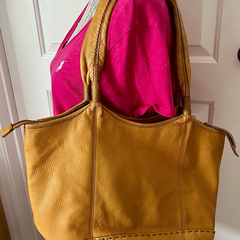 Gently used the Sak brand handbag/purse with double handles.